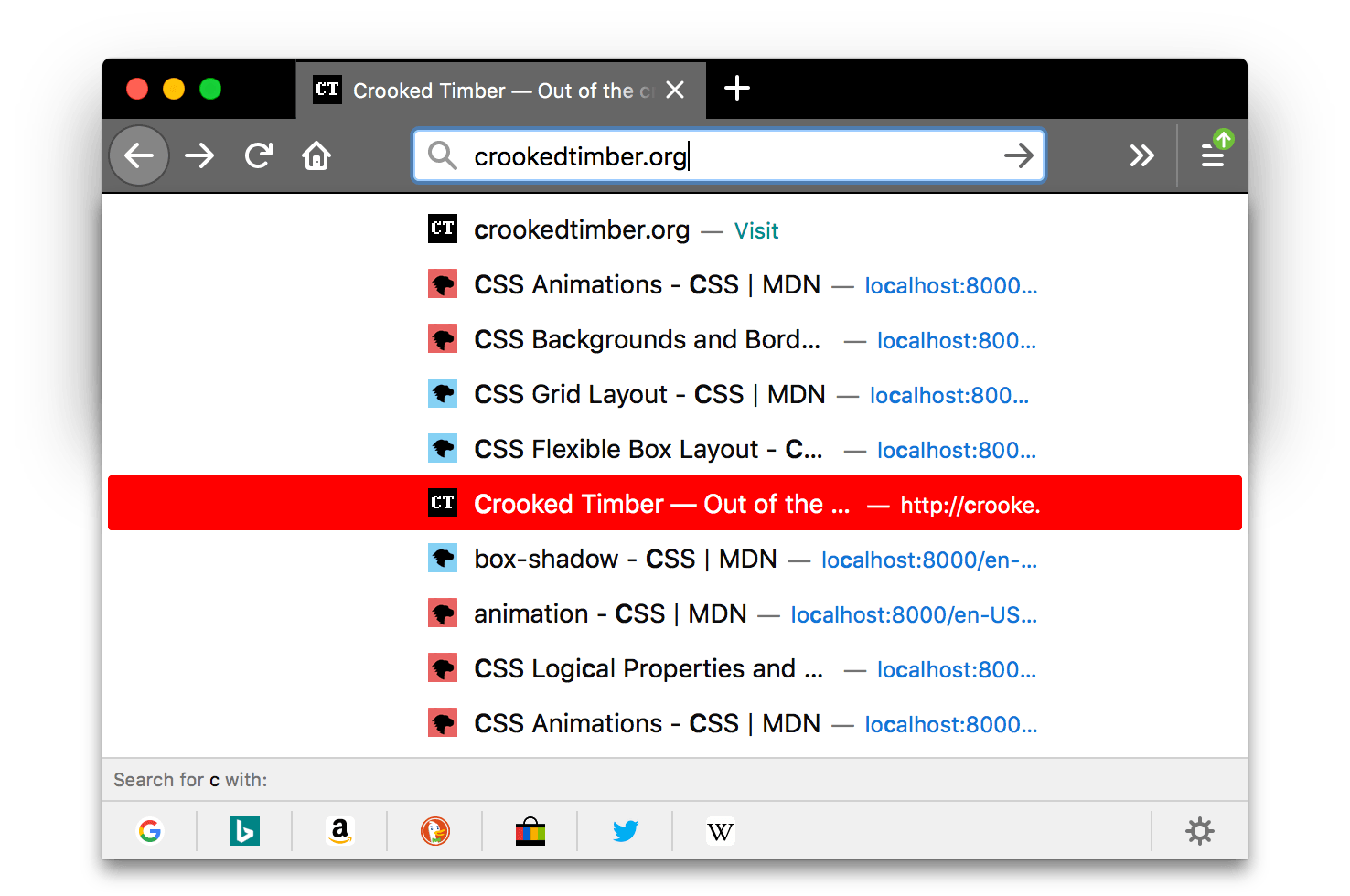 Screenshot von Firefox ist schwarz. Die Tabs und die URL-Leiste sind heller grau mit weißen Symbolen und Text. Ein Popup mit Suchergebnissen wird angezeigt, wobei das hervorgehobene Element einen roten Hintergrund hat. Die Hintergrundfarbe des hervorgehobenen Elements im Popup ist rot.